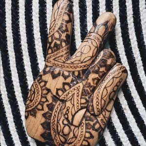 Boho wooden carved peace sign